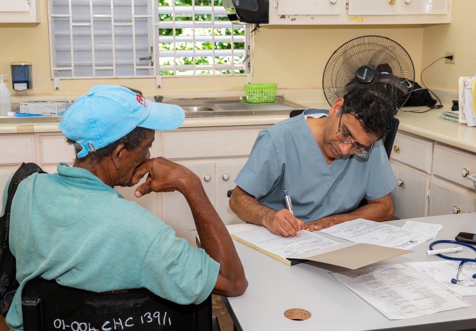CHO doctor consulting with patient at Healthy Days clinic