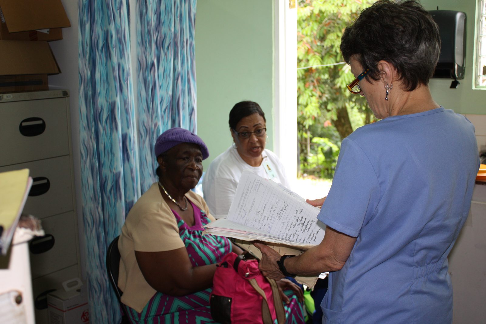 CHO volunteers reviewing patient records